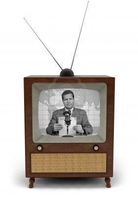 9519748-1950-s-television-with-a-newscaster-reading-a-news-bulletin